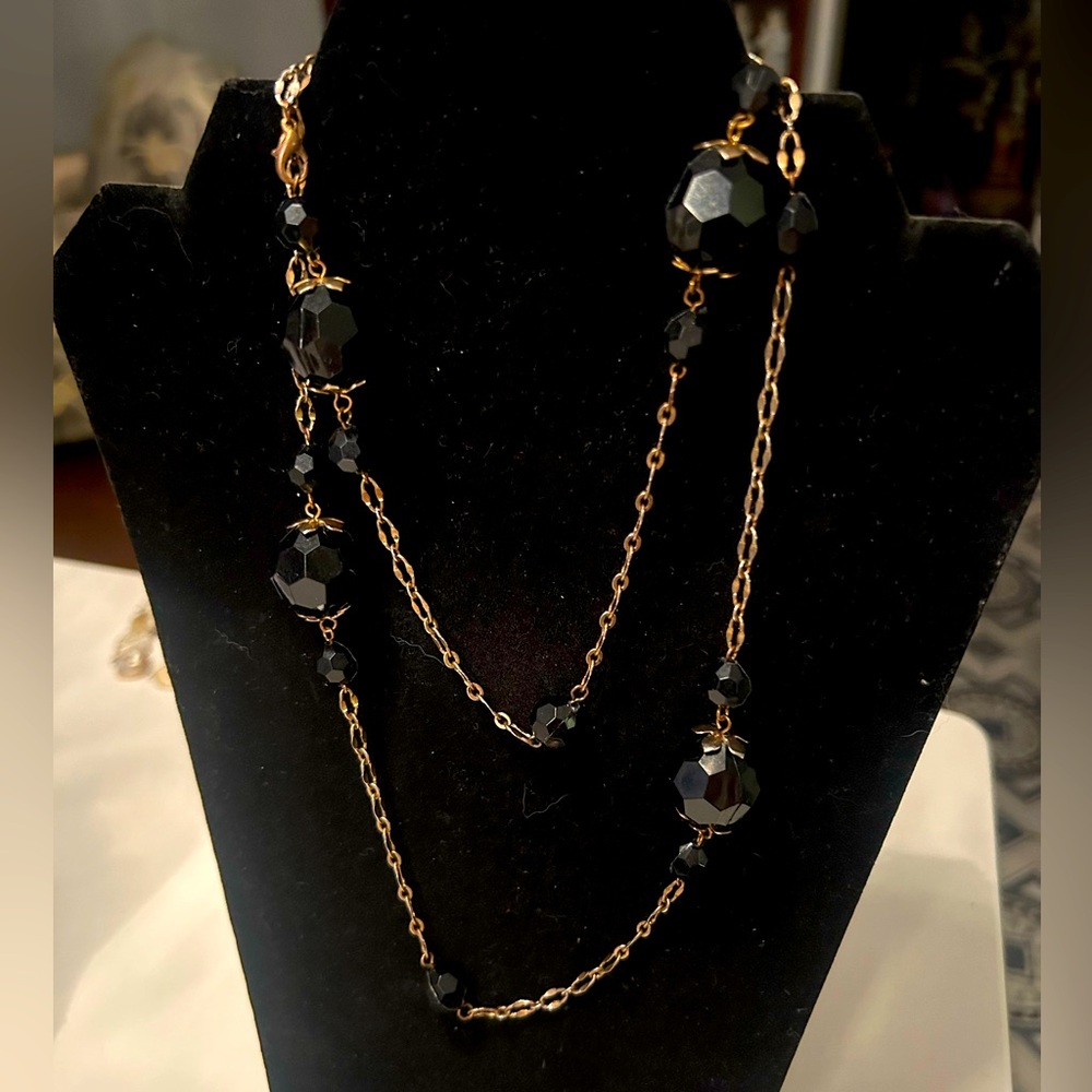 Gold-tone chain and chunky black beaded necklace